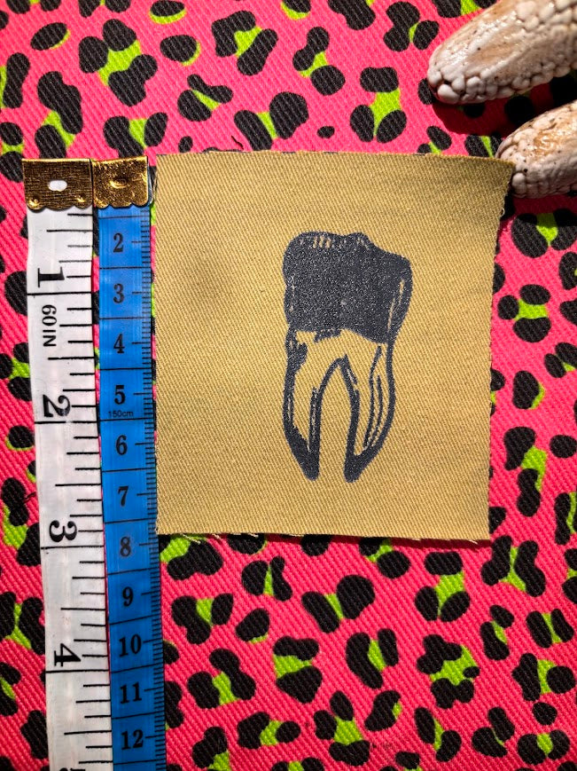 loose tooth patch. a mini patch with one toof