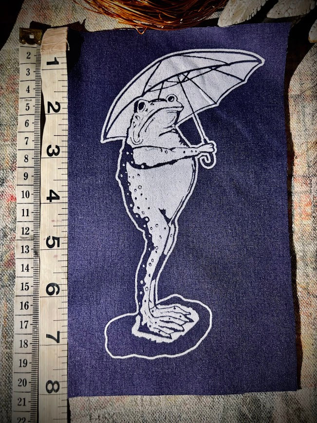 Sad frog holding an umbrella in the rain sew on patch.