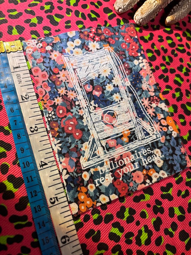 Guillotine sew on patch. Billionaires, rest your head