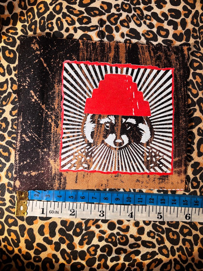 Are We not Trashy? Raccoon with a Devo hat patch