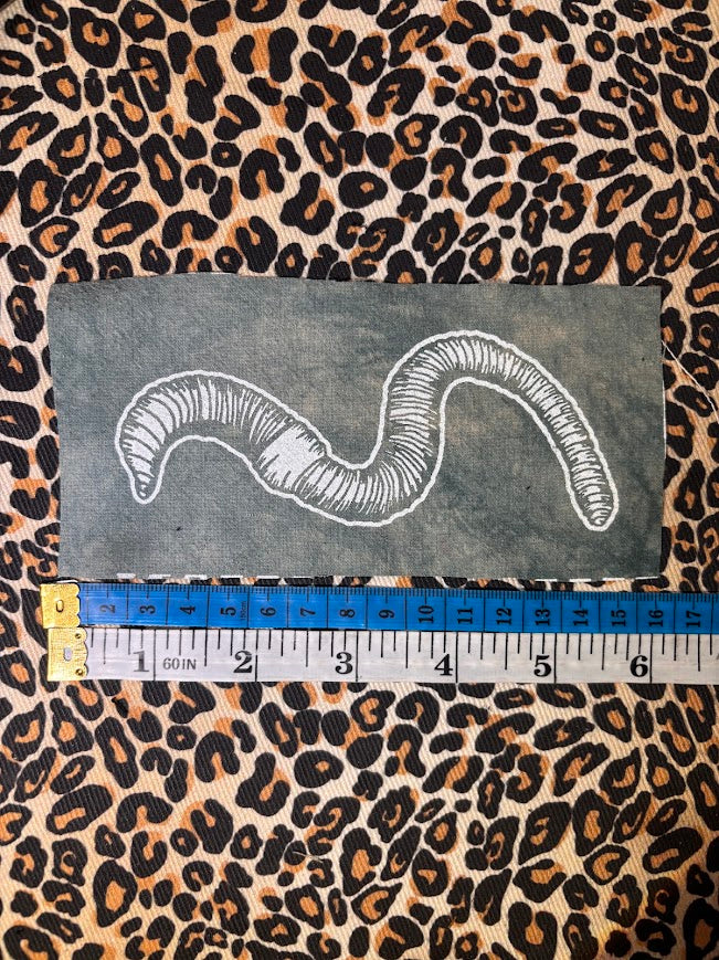 Worm sew on patch