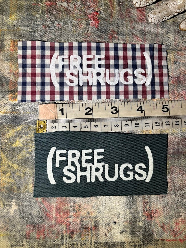 Free Shrugs sew on patch. never mind free hugs, you get free shrugs.