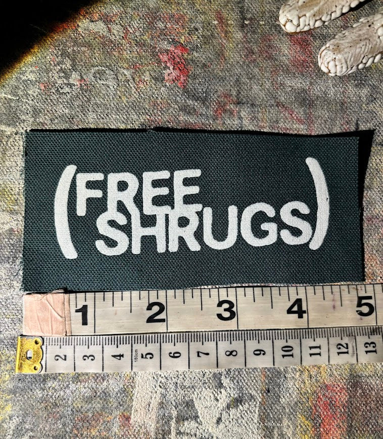 Free Shrugs sew on patch. never mind free hugs, you get free shrugs.