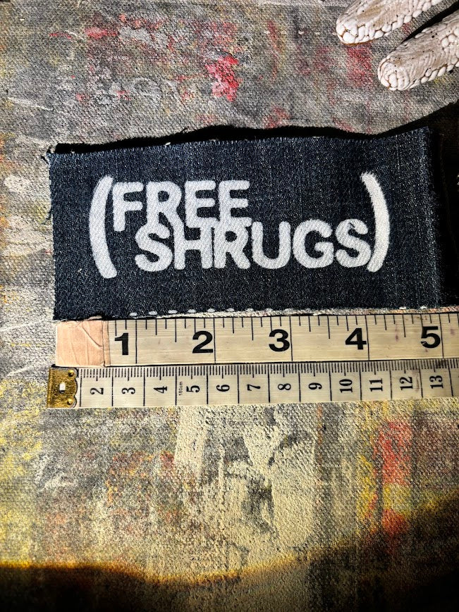 Free Shrugs sew on patch. never mind free hugs, you get free shrugs.