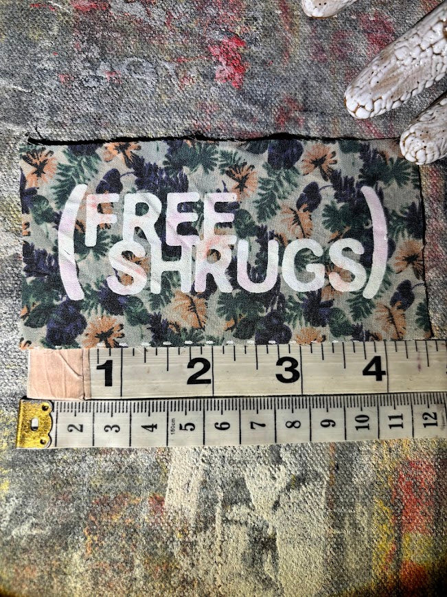 Free Shrugs sew on patch. never mind free hugs, you get free shrugs.