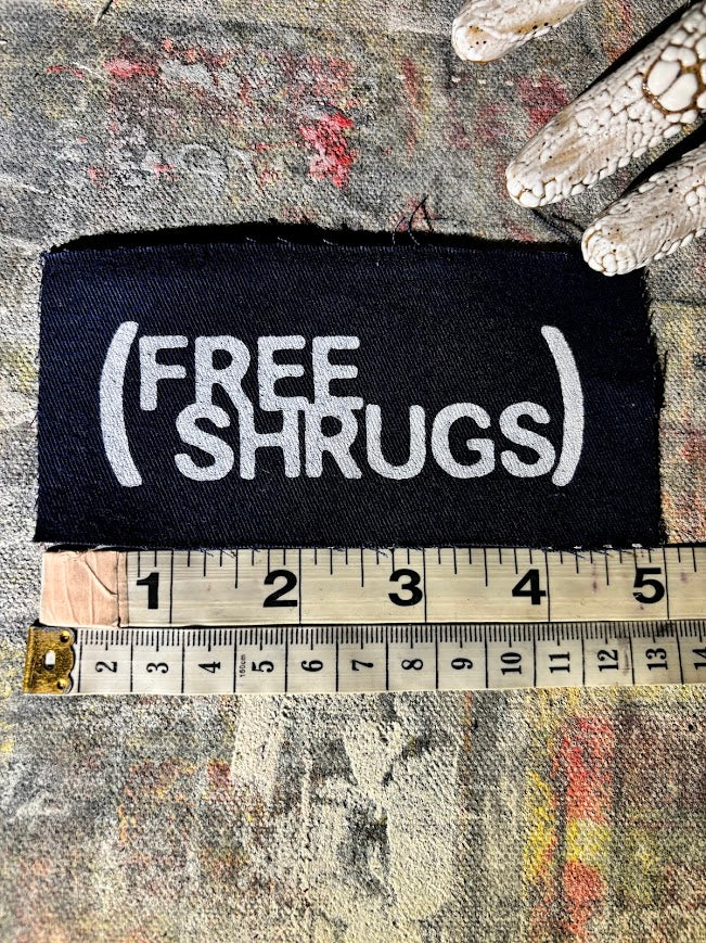 Free Shrugs sew on patch. never mind free hugs, you get free shrugs.