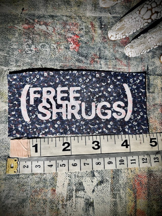 Free Shrugs sew on patch. never mind free hugs, you get free shrugs.