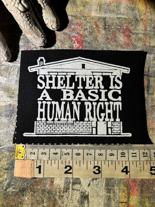 Shelter is a basic human right. sew on patch.