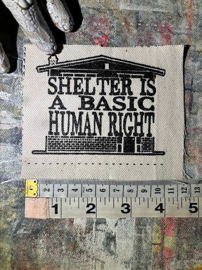 Shelter is a basic human right. sew on patch.