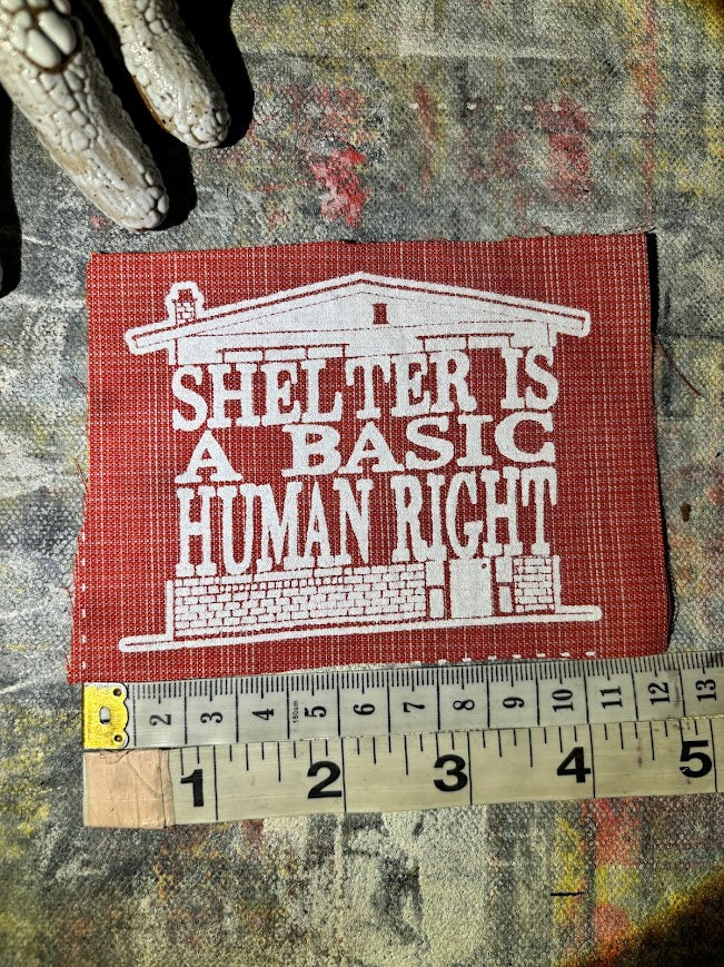 Shelter is a basic human right. sew on patch.