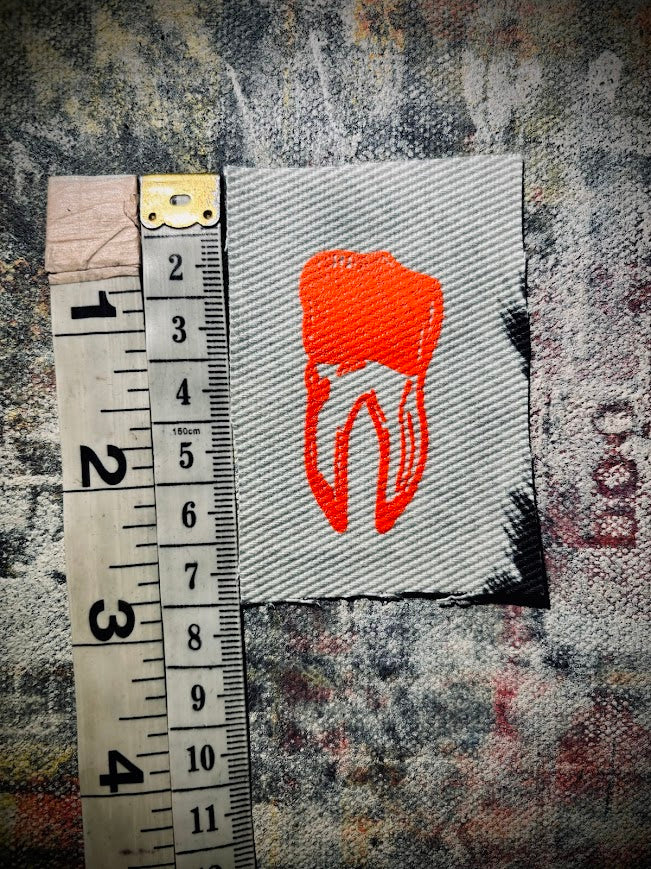 loose tooth patch. a mini patch with one toof.