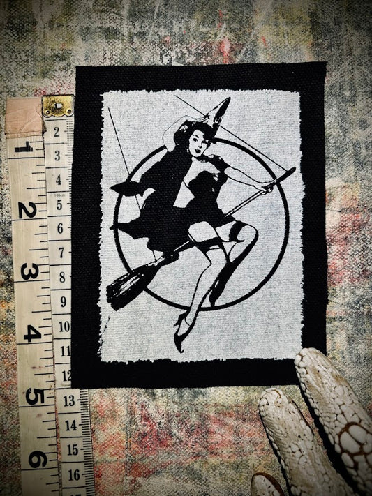 Witch pinup riding a broom sew on patch