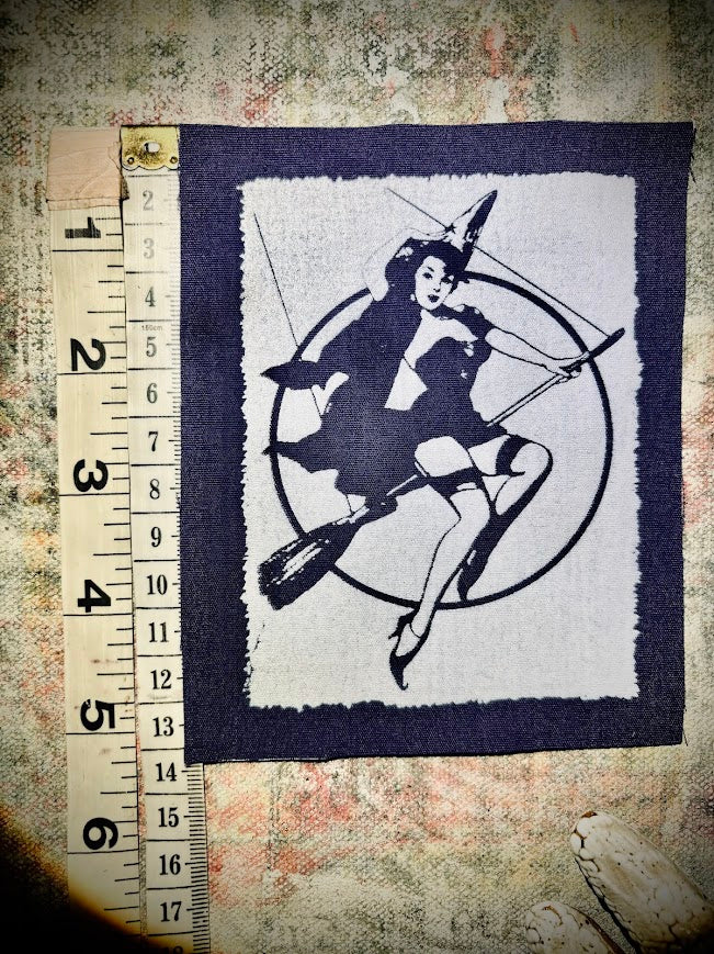 Witch pinup riding a broom sew on patch