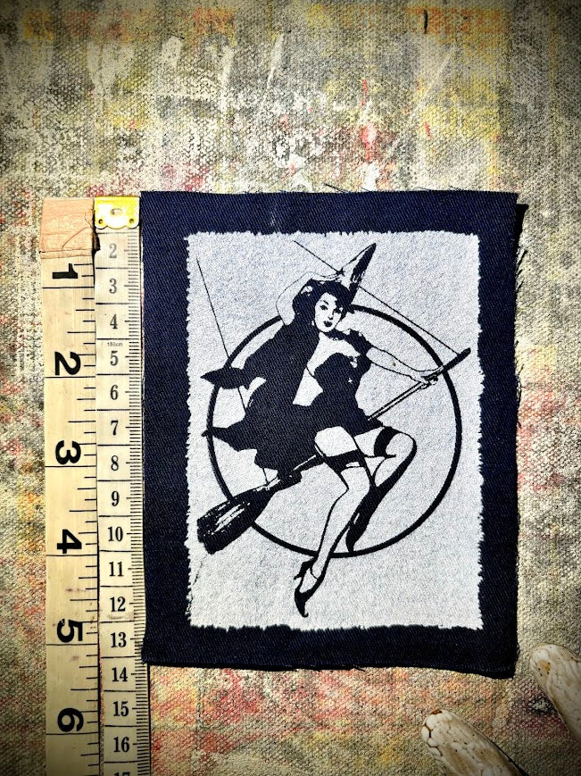 Witch pinup riding a broom sew on patch